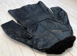 Black leather skirt/coat with fur collarFloby Överskottslager
