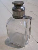 Glass bottle square, with brass lid, curiosityFloby Överskottslager