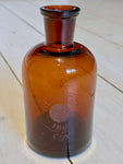 Medicine bottle with engraving